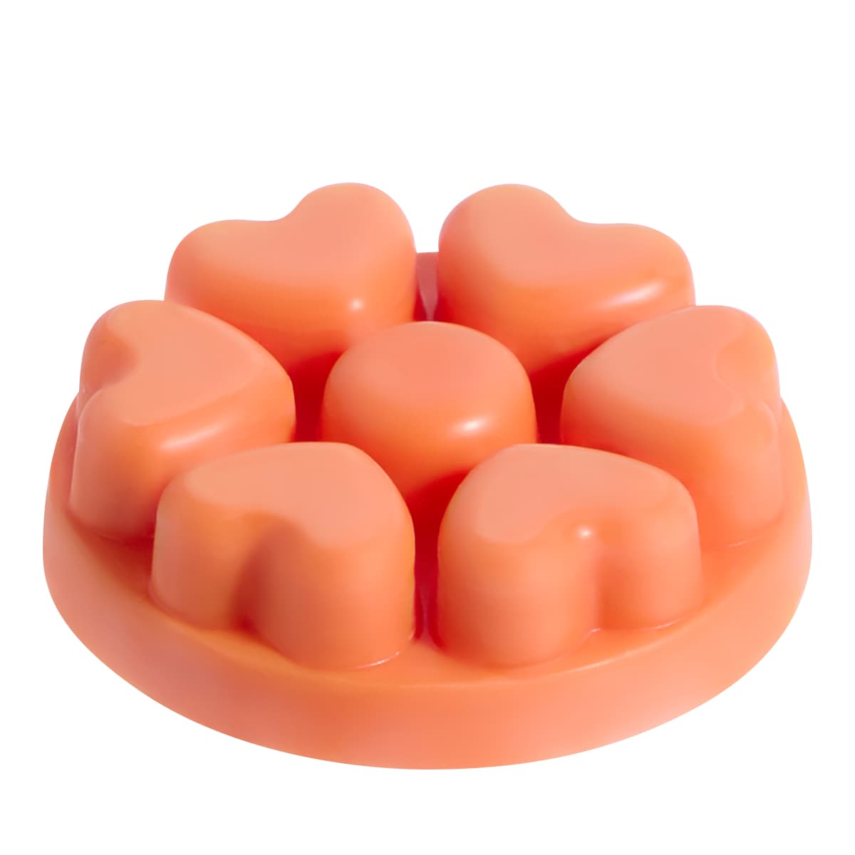 Spiced Pumpkin heart shaped wax melts in an orange color against a white background.