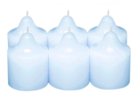 Snowflakes & Cotton Votive Candles six light blue votive candles against a white background.