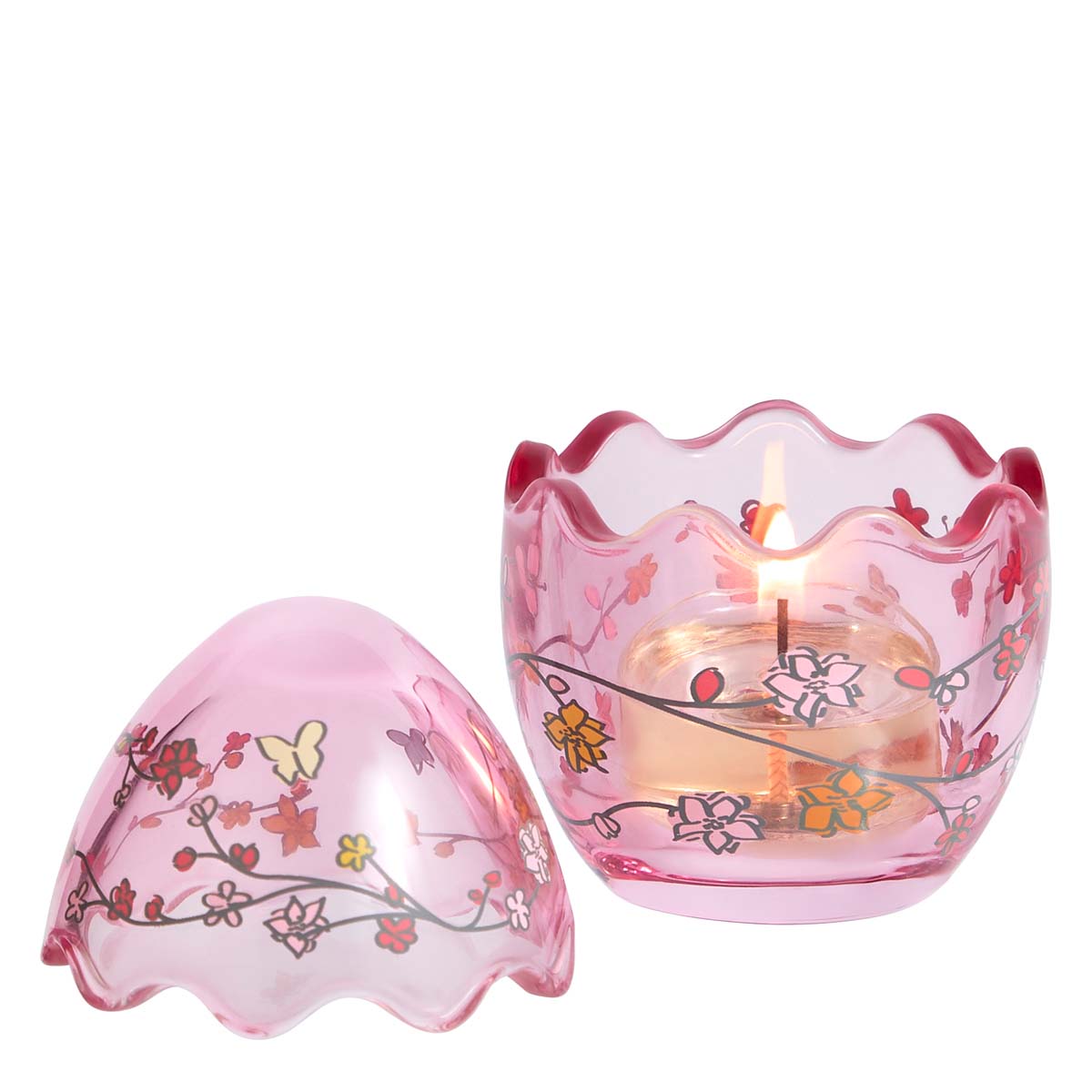 Flowered Egg Tealight Holder pink glass holder shown with a lit candle and the lid sitting next to it.