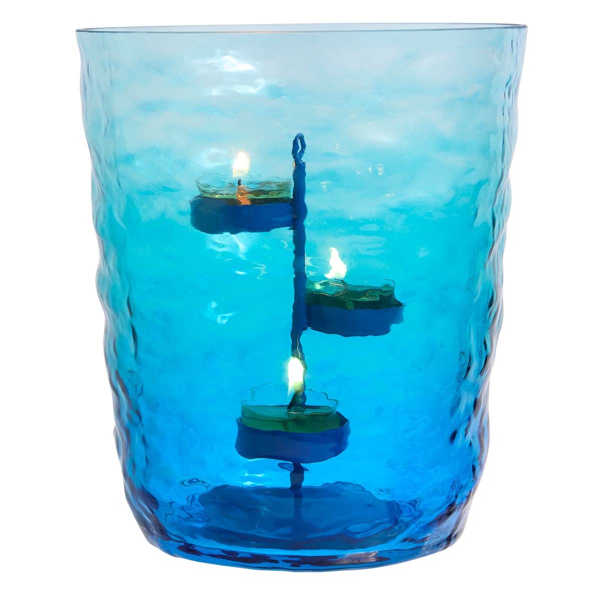Ombre Waves Hurricane candle holder with a metal 3-tealight tree inside, displaying three lit candles. The holder has shades of blue and green, resembling rippling water.