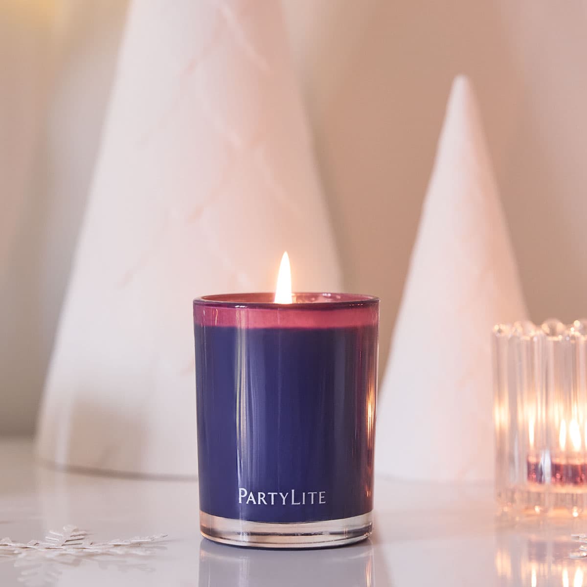 Twilight Lavender Escential Jar candle in a purple color jar set against a light background on a light surface.