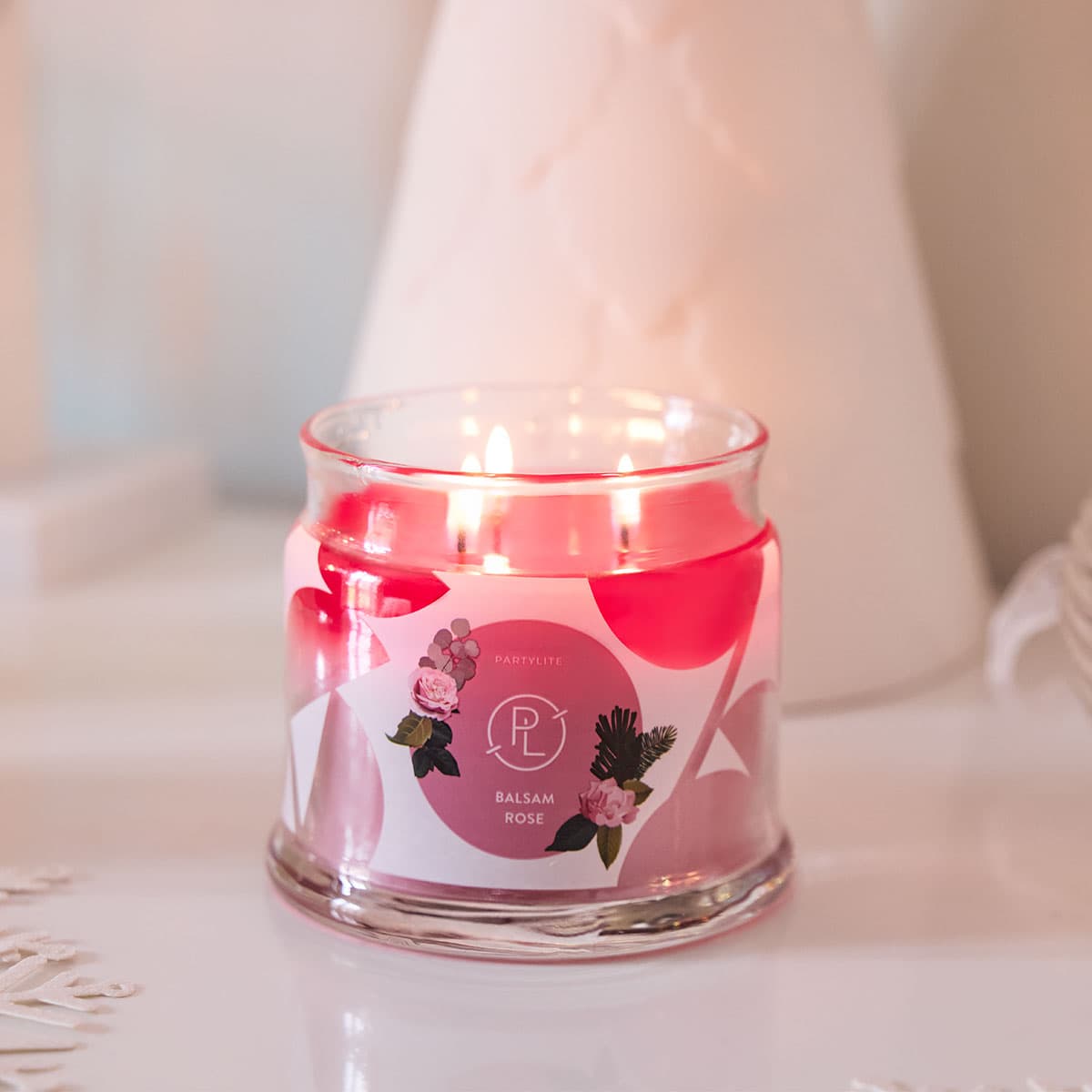 Balsam Rose 3-wick Jar Candle lit against a light background.
