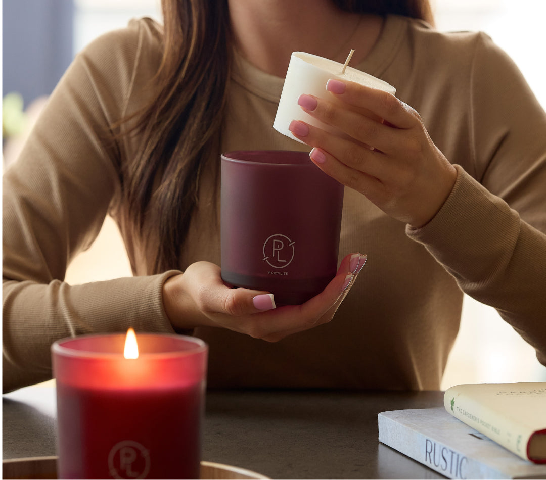 woman holding a refillable candle