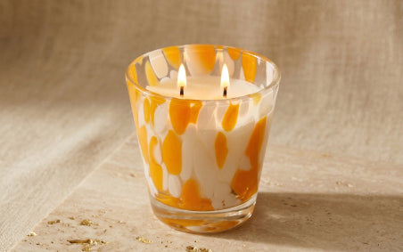 Happy Marbled Small Jar from the Mood collection on a smooth stone surface with stone background