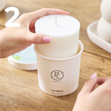 removing a candle refill from packaging