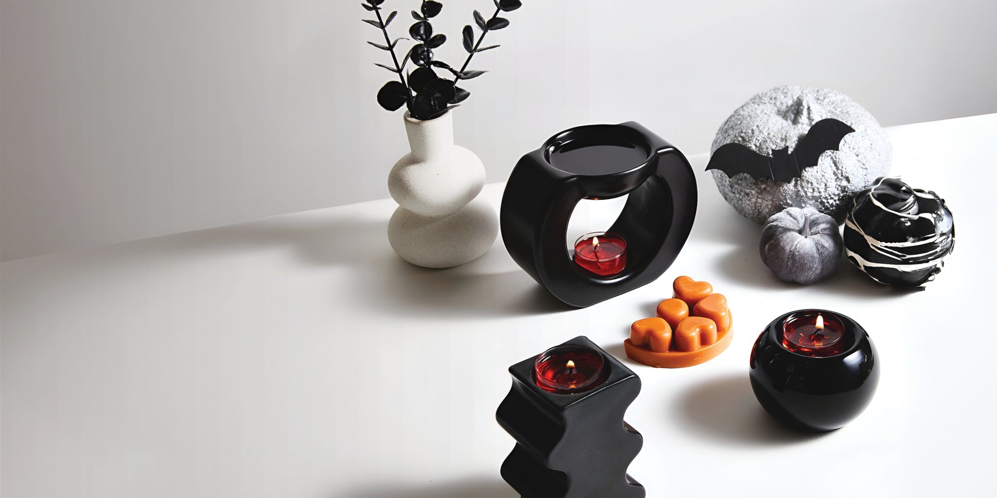 Halloween table with black candle holders and black candle warmer