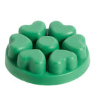 Evergreen Fir heart shaped wax melts against a white background.
