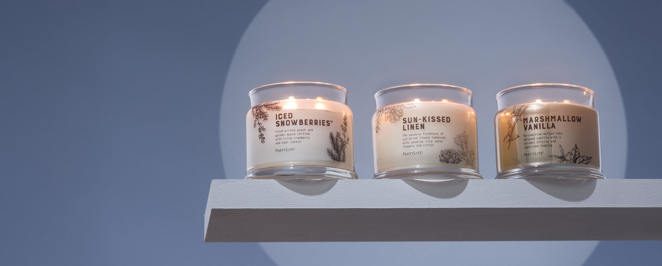 Iced Snowberries, Sun-Kissed Linen and Marshmallow Vanilla 3-wick jar candles on a floating shelf 