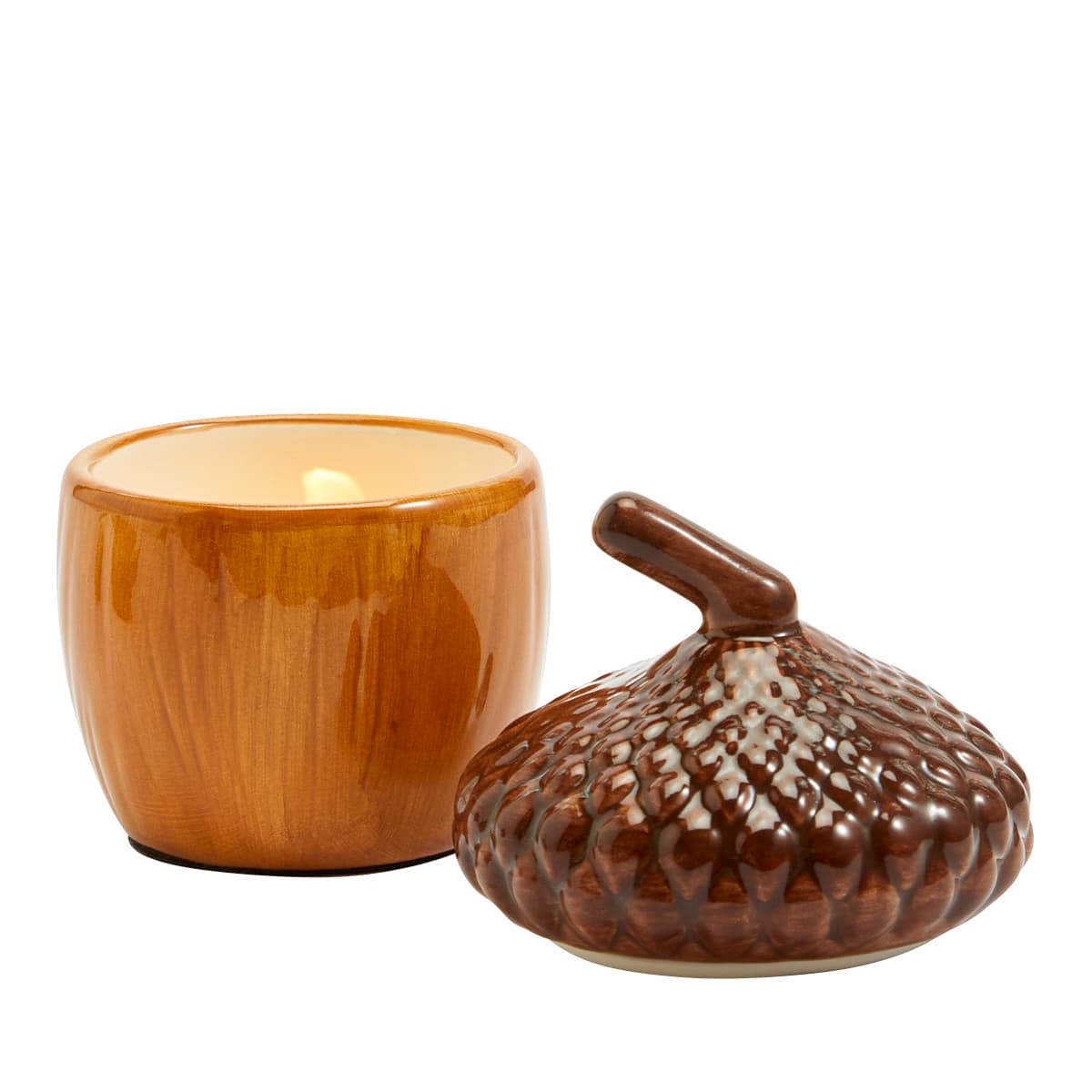 Acorn Tealight Holder Pair with a lit tealight against a white background.