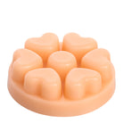 Seaside Neroli peach coloured wax melts against a white background.