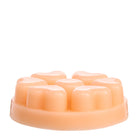 Seaside Neroli peach coloured wax melts against a white background.